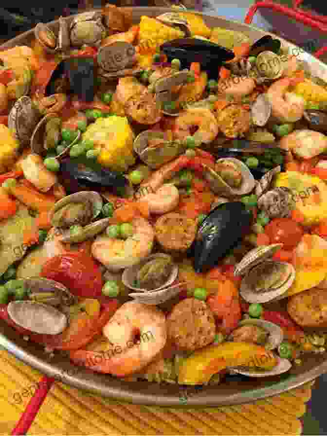 A Colorful Paella Adorned With Seafood, Vegetables, And Saffron Threads Spanish Dinner Recipes: A Quick Guide To Some Delicious Spanish Food: Spanish Cuisine Recipes