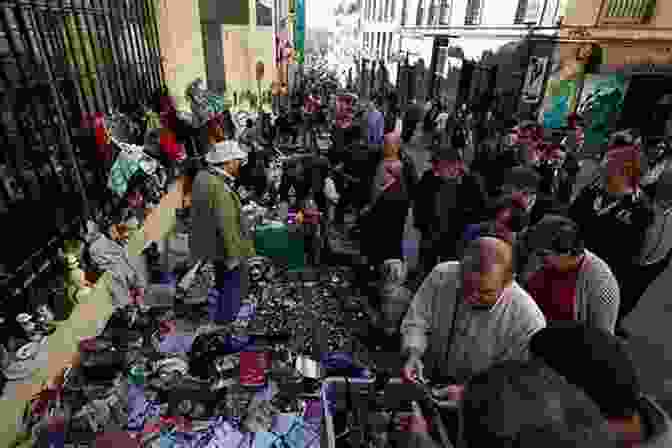 A Crowd Of People Browsing Through Vintage Treasures At El Rastro Flea Market. Madrid Travel Guide 2024 : Top 20 Local Places You Can T Miss In Madrid